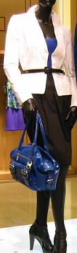 white-jacket-blue-top-black-skirt-with-blue-purse